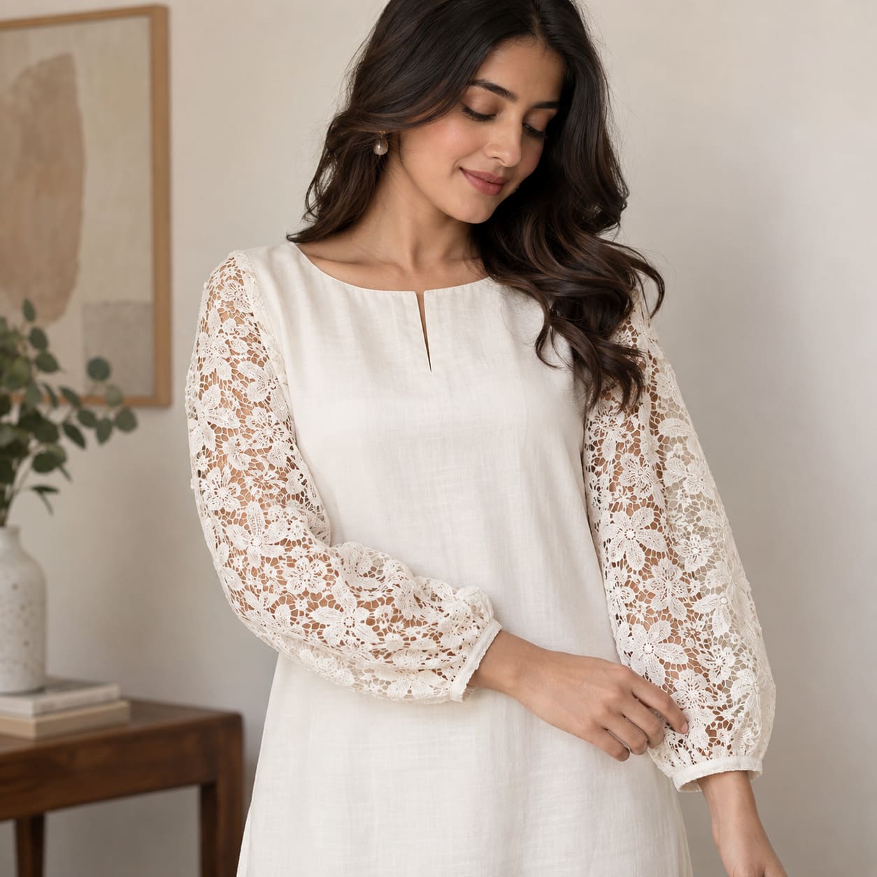 White kurta with full floral lace sleeves and a simple round neckline
